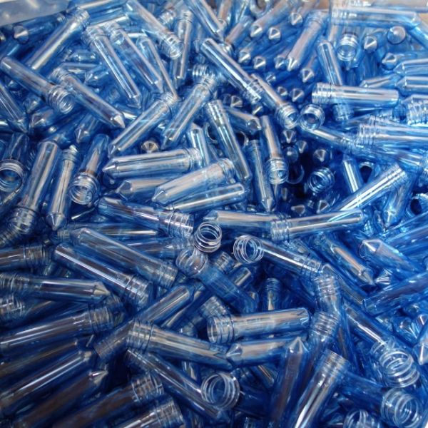 Several blue color PET preforms in the container