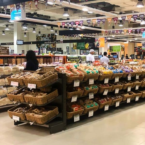 Several shelves with goods in the supermarkets.